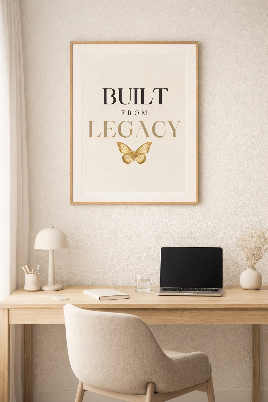 Home office with a desk, chair, and framed poster on the wall.
