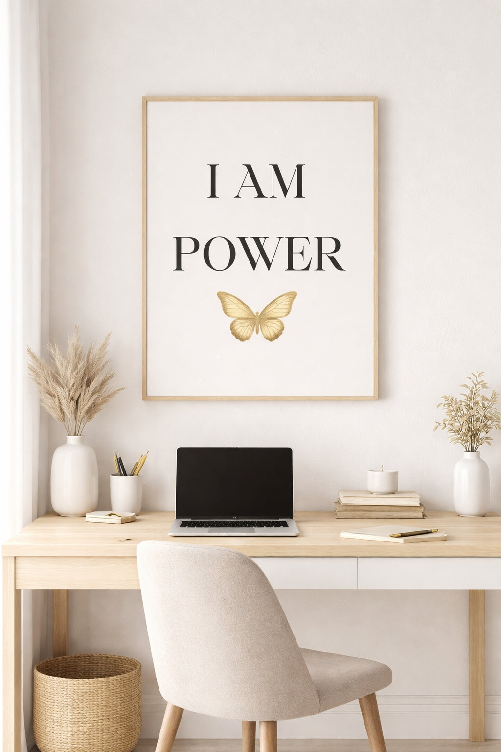 Home office with a desk, chair, laptop, and motivational poster on the wall.